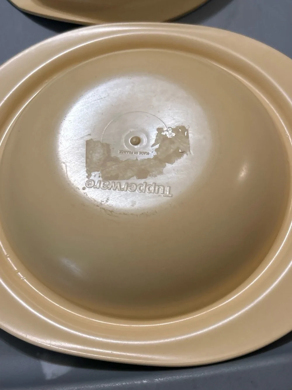 Tupperware very gently
